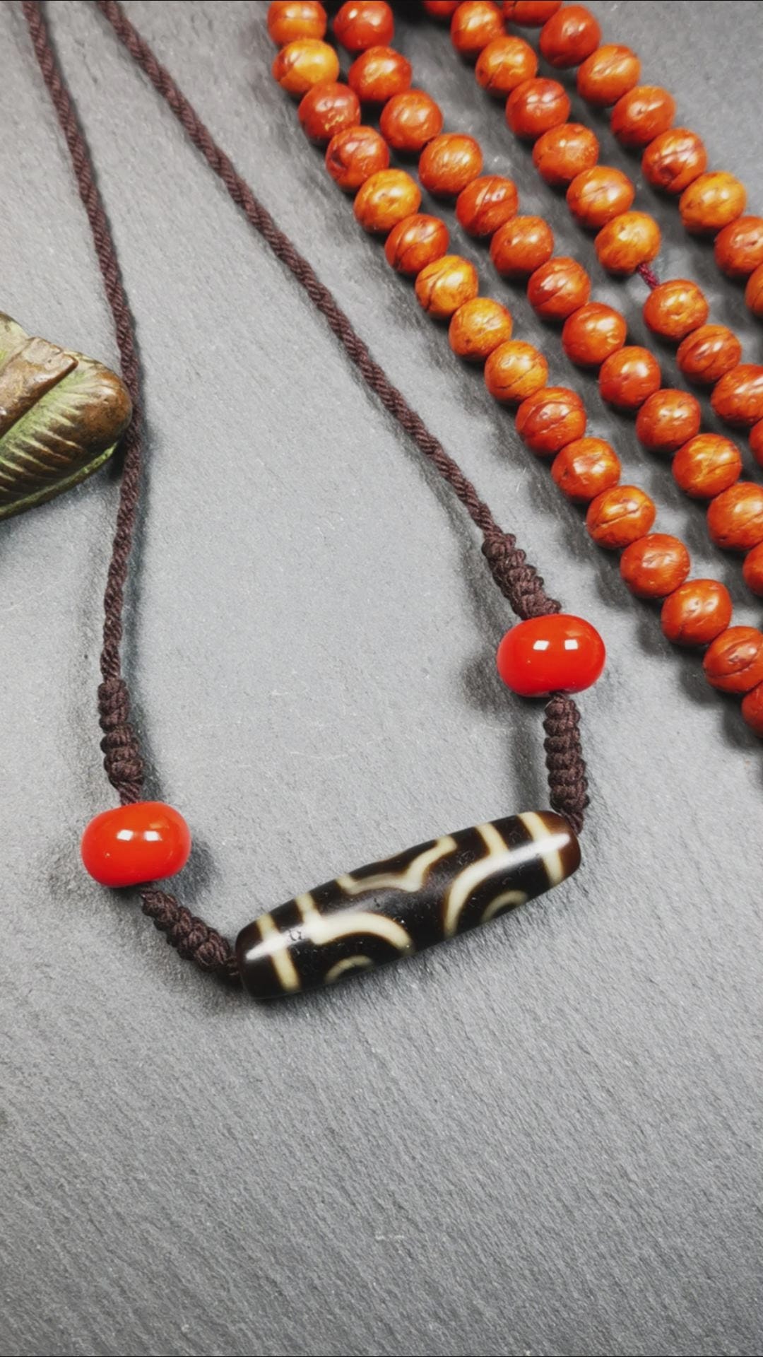 This necklace was hand-woven by Tibetans from Baiyu County, the main bead is a 3 eyed dzi bead, paired with 2 agate beads,about 30 years old. It can be worn not only as a fashionable accessory but also holds cultural and religious significance.