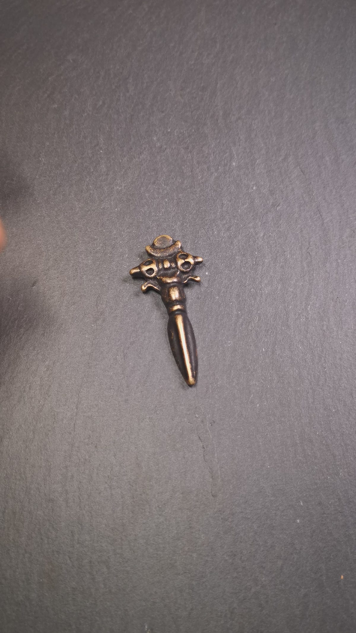 This beautiful phurba pendant was collected in Rejia Monastery,Baiyu,Tibet,about 70 years old.It was blessed by lama. It was made of brass, whole body is yellow,at the top is a mani jewel and horizontal vajra, the bottom is a vertical phurba