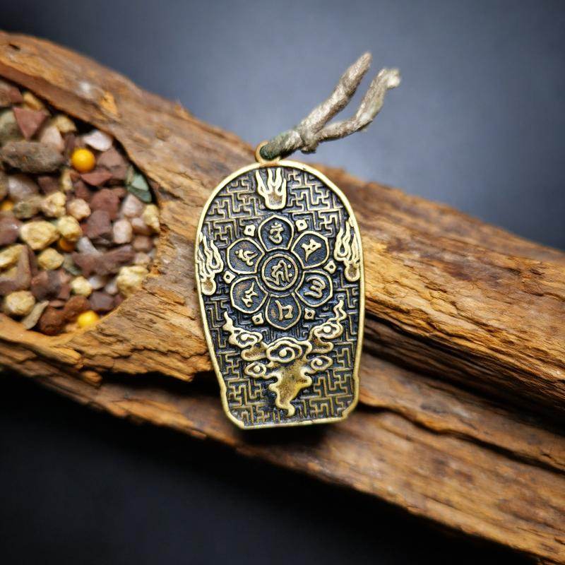 Amulet,Padmapani,Avalokitesvara - Tibetan Buddhist amulet, detailed view