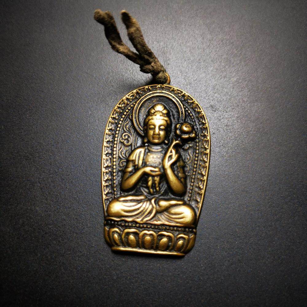 Amulet,Padmapani,Avalokitesvara - Tibetan Buddhist amulet, close-up detail